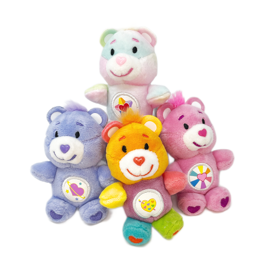 4 colorful tiny Care Bear plush toys