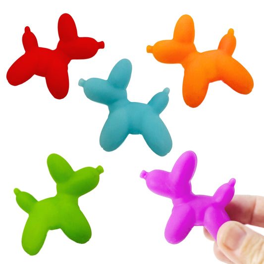 A hand holds a small balloon toy dog. Four other colorful balloon toy dogs are in the background