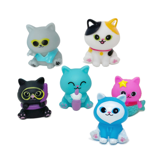 Six toy rubber cats.