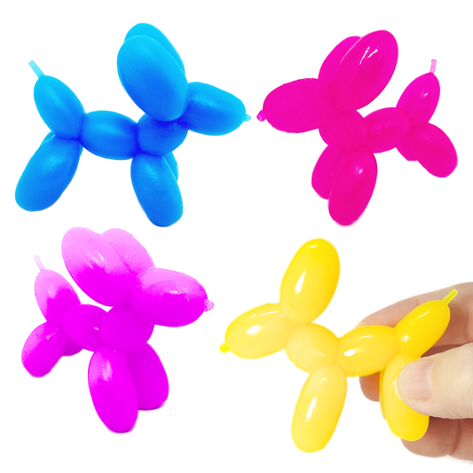 A hand holds a yellow stretchy balloon toy dog. Blue, pink, and purple ones are pictured in the background,