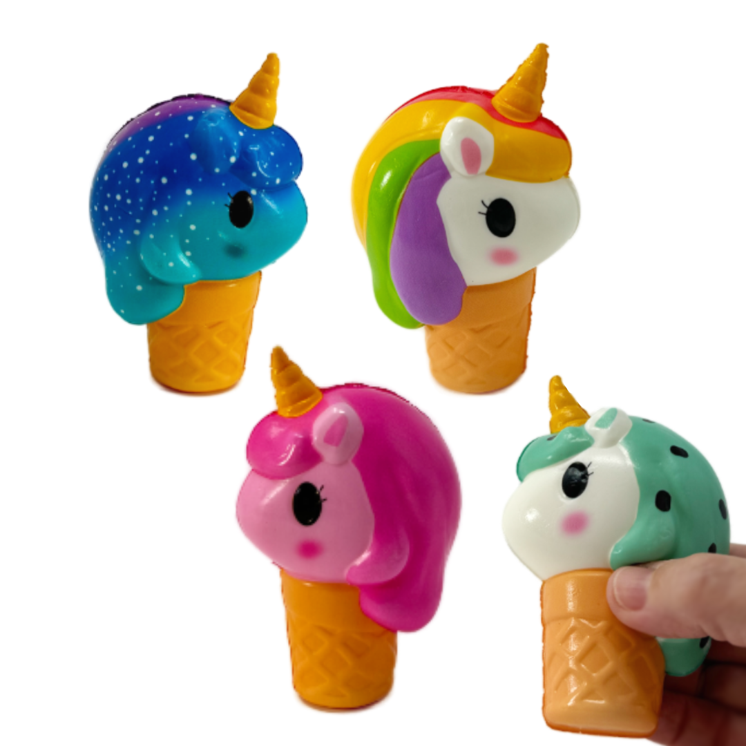 A hand holds a toy unicorn with an ice cream cone body, three other colorful versions are in the background