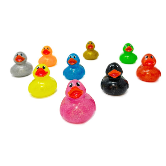 A collection of nine colorful glittery toy rubber ducks.