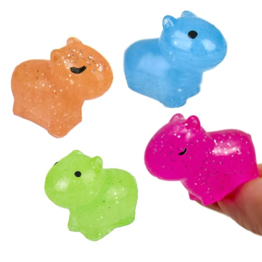 Cute capybara squish toys in four sparkly colors with gummy texture.