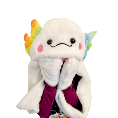 A kid is wearing a white plush axolotl hat and using the mittened attached scarf to play peek-a-boo