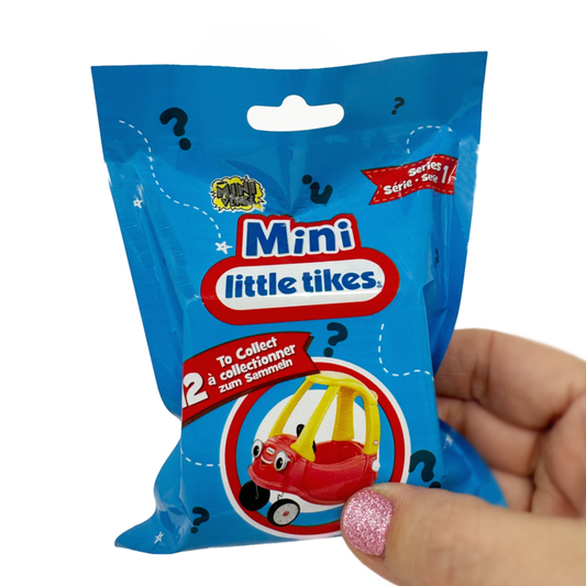 A hand holds A hand hold a Miniverse Mini Little Tikes Surprise Toy Blind Bag