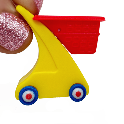 Fingertips hold a Miniverse Mini Little Tikes Shopping Cart