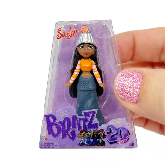 A hand holds a Miniverse Mini Bratz doll toy micro figure