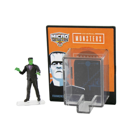 A World's Smallest Micro Universal Monster Figure of Frankenstein standing next to his collectible packaging