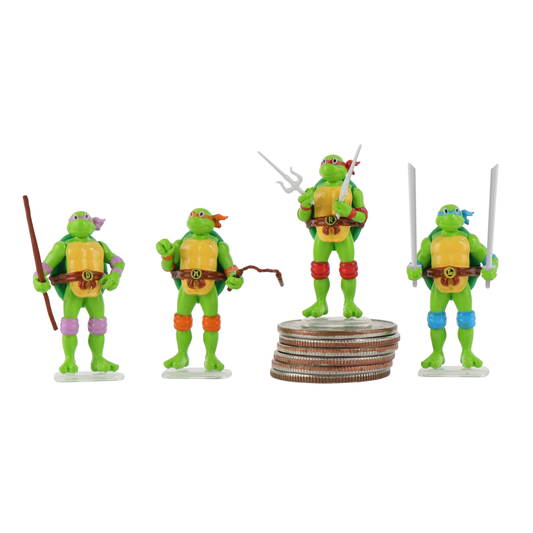 Four Micro Teenage Mutant Ninja Turtles. One is sitting on a stack of quarters