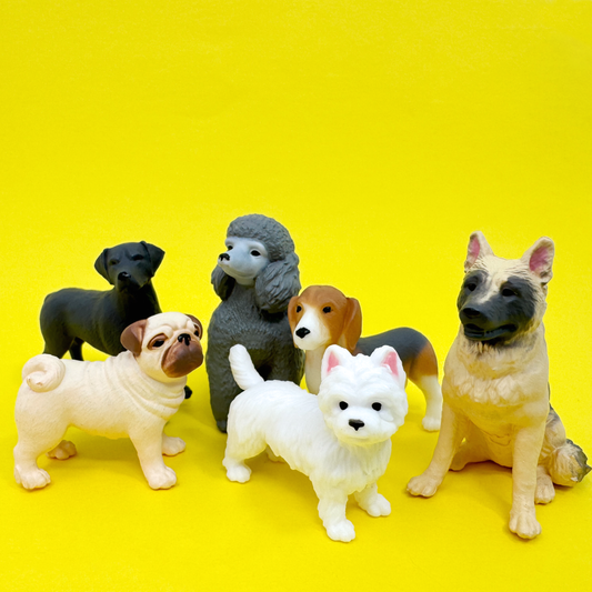 A group of 6 tiny toy dog figurines in several  breeds including Bichon Frise, German Shepherd, Beagle, Poodle, Black Lab, and Pug stand on a yellow background