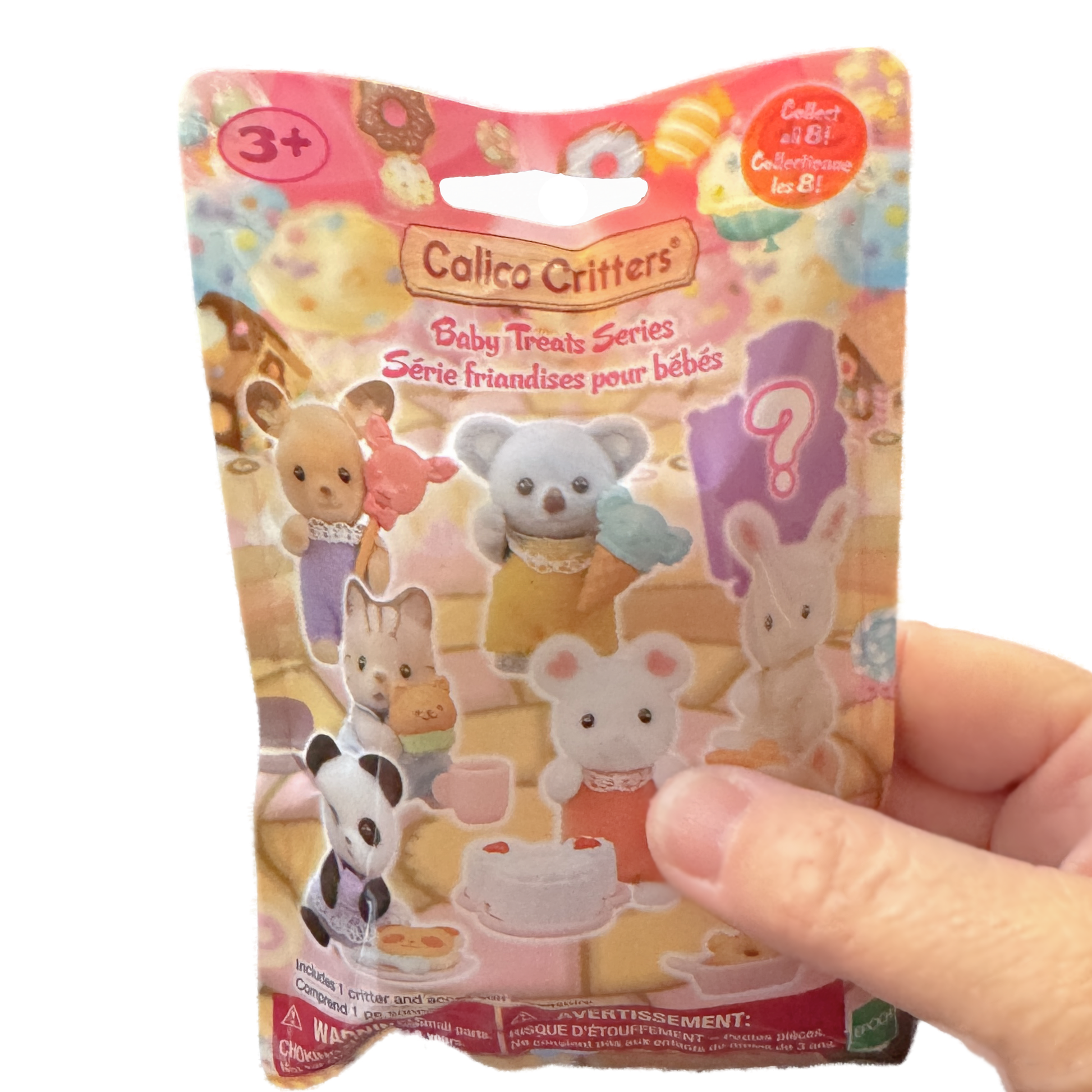 A hand holds a Calico Critters Sylvanian Baby Treats Blild Bag