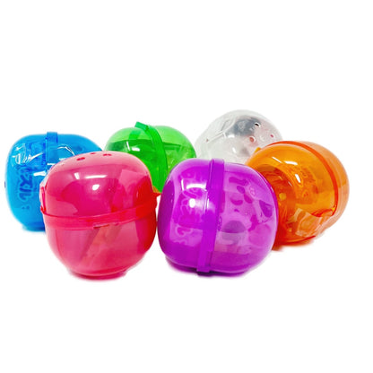 Six colorful capsule surprise toys with cat magnets inside.