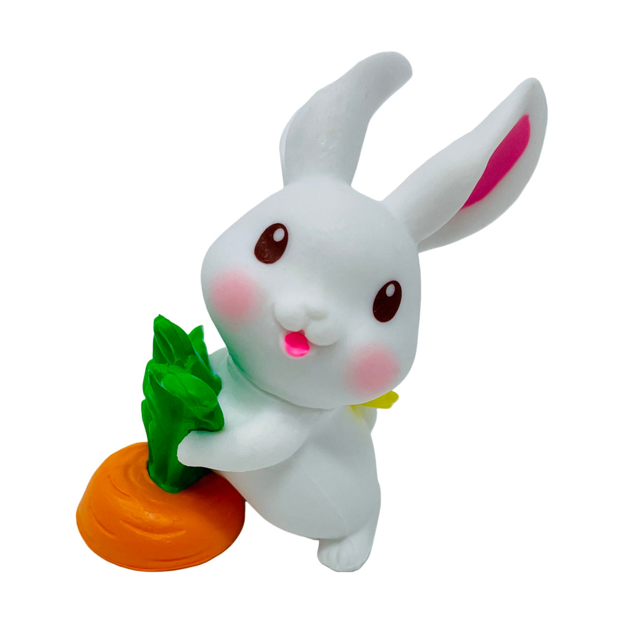 A  white toy bunny figurine pulling on a carrot.