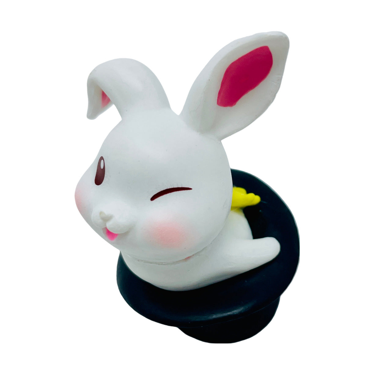 A  white toy bunny figurine jumping out of a hat.