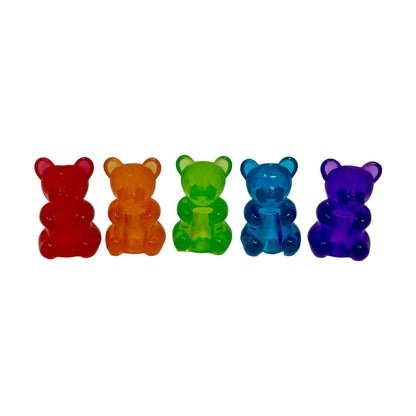 Five colorful gummy bear shaped pencil toppers.