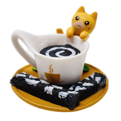 A toy figurine of an orange toy cat with a white toy coffee cup.