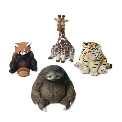 four small Rben Studios toy animal figurines.