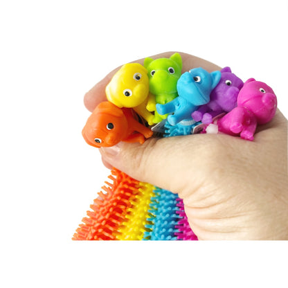 A hand holding six cat and dog themed colorful stretchy string fidget toys.