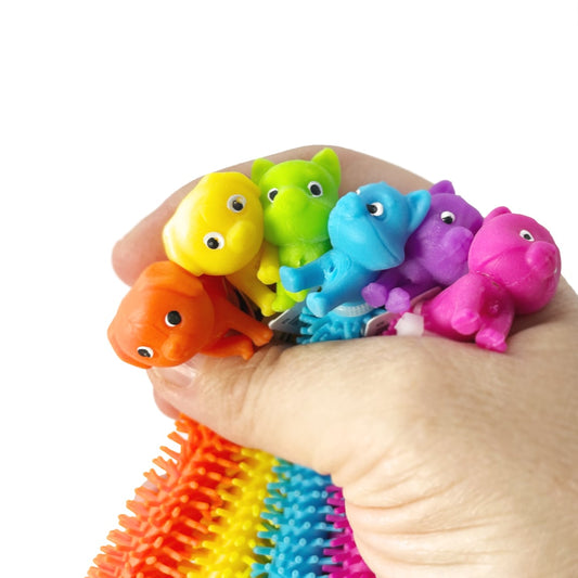 A hand holding six cat and dog themed colorful stretchy string fidget toys.